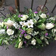 Lilac and white coffin spray